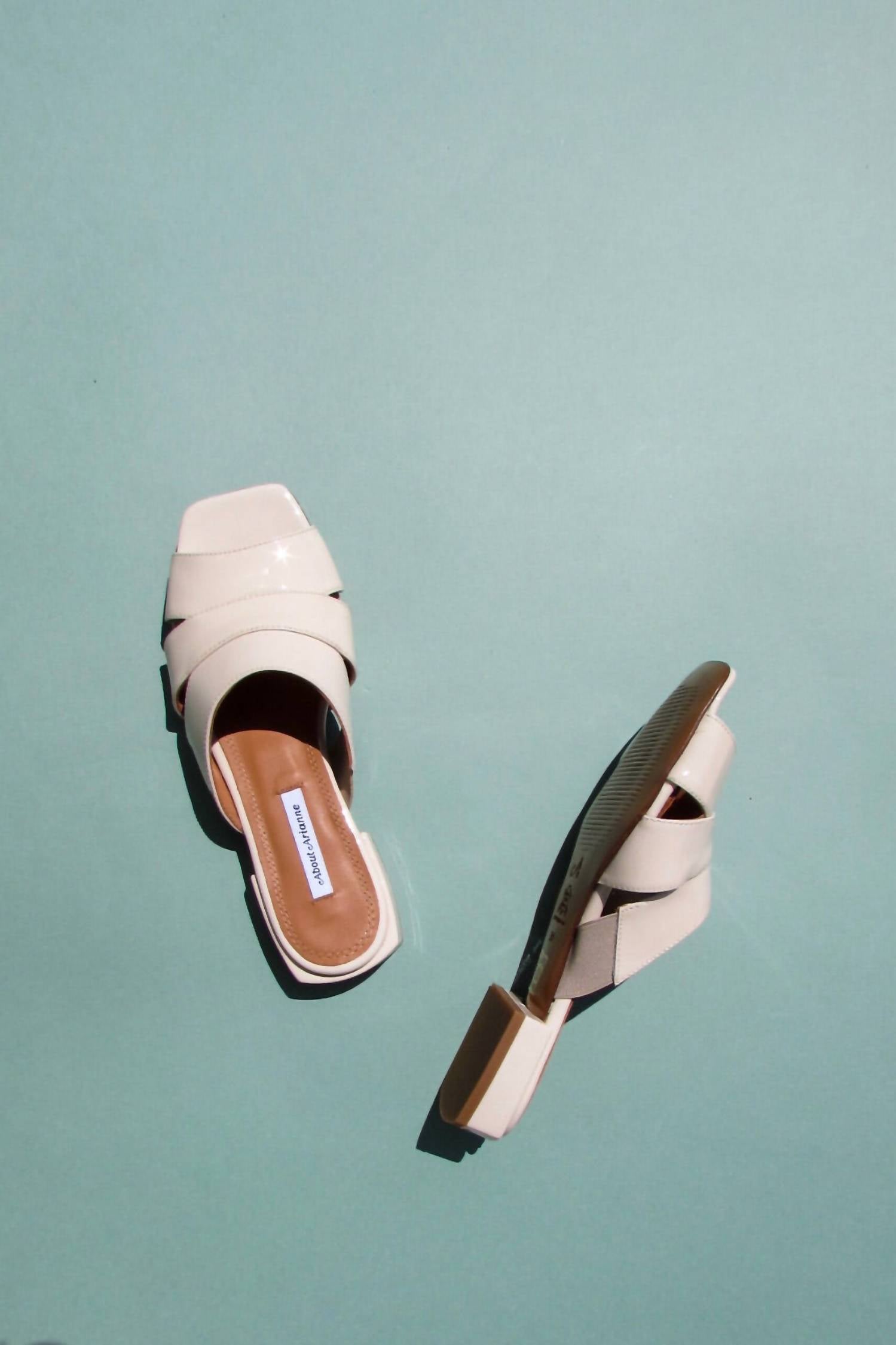 b0d24c7e-f007-4b10-aadc-ad36e74e92a7-upscale_15k-1500x1500-70 About Arianne - Women's Sybille Vegan Flat Sandal - Image 1